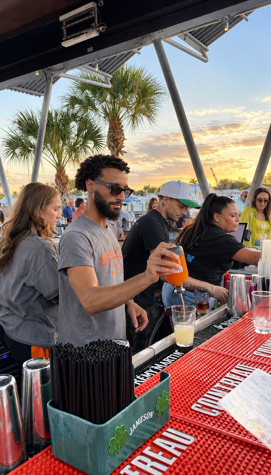 Bartenders pouring cocktails at sunset at Celebration Park Naples